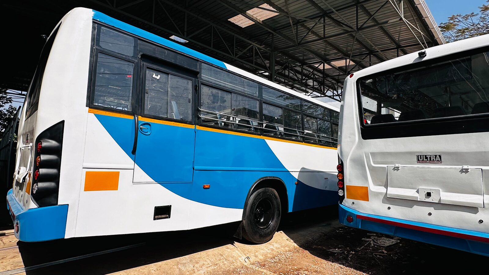 Two Ultratech-built buses parked side by side
