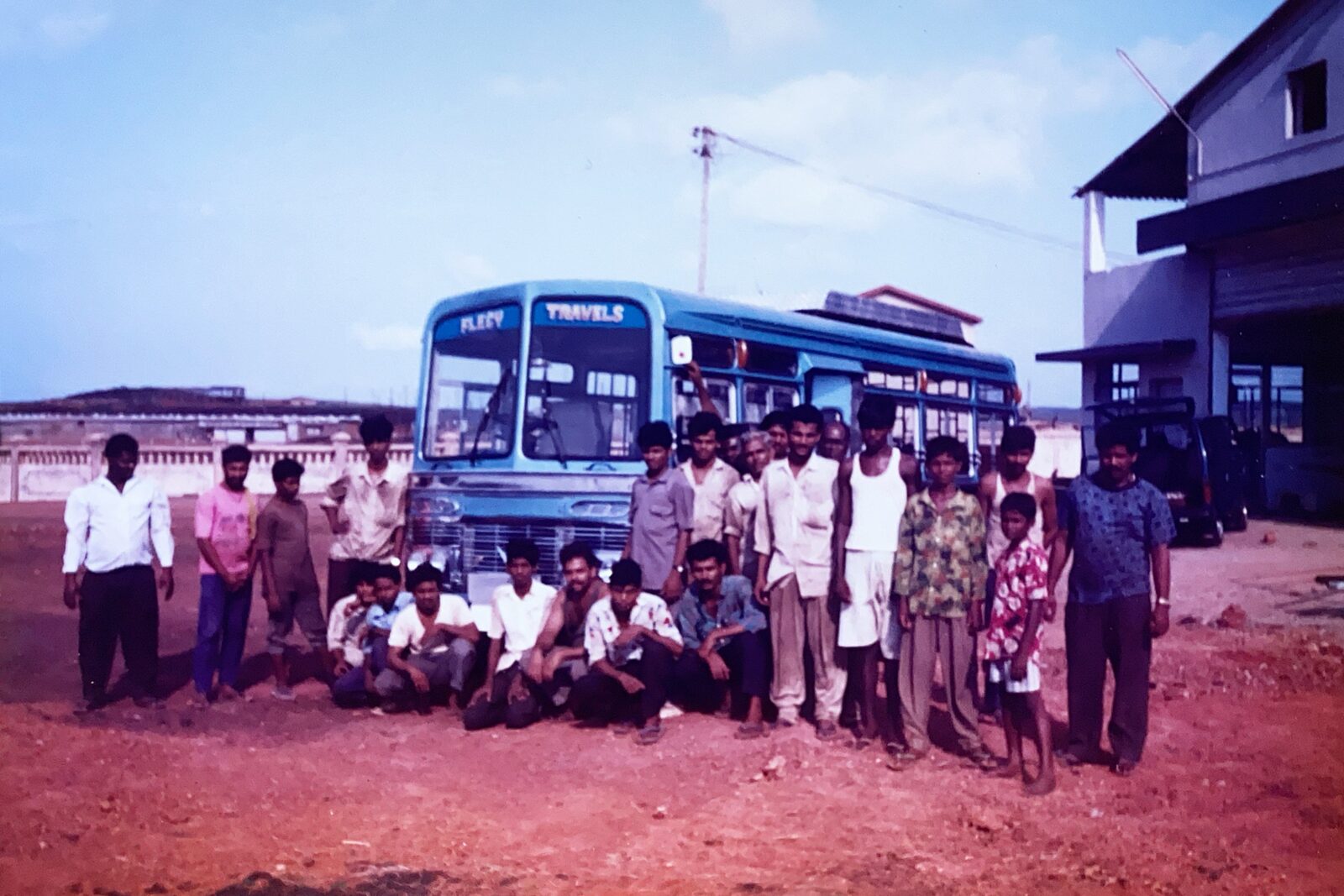 The Ultratech Automotive team beside a completed state transport bus
