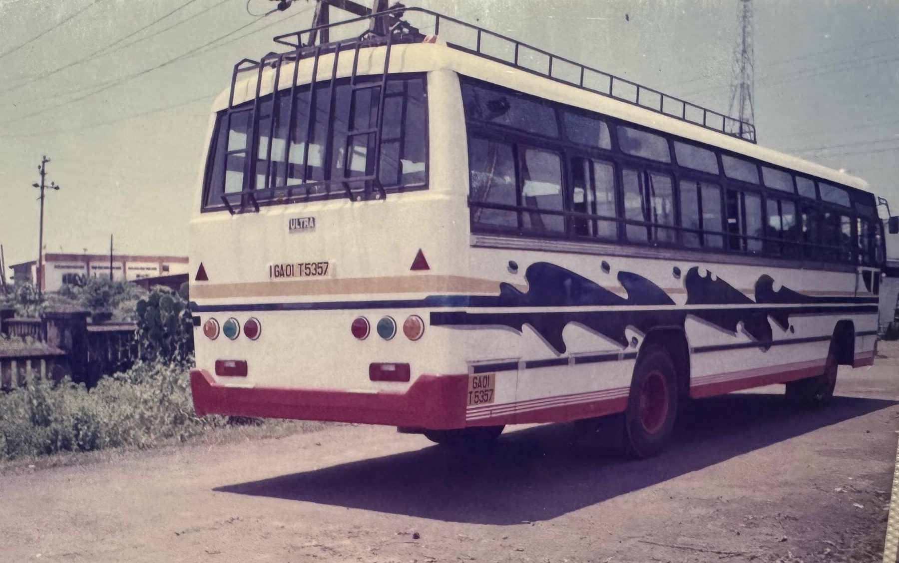 Ultra-liveried bus with a wave graphic, built by Ultratech Automotive