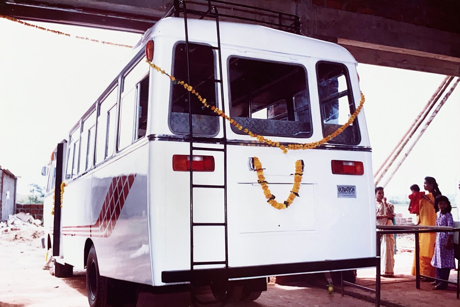 A newly completed bus, garlanded ahead of handover