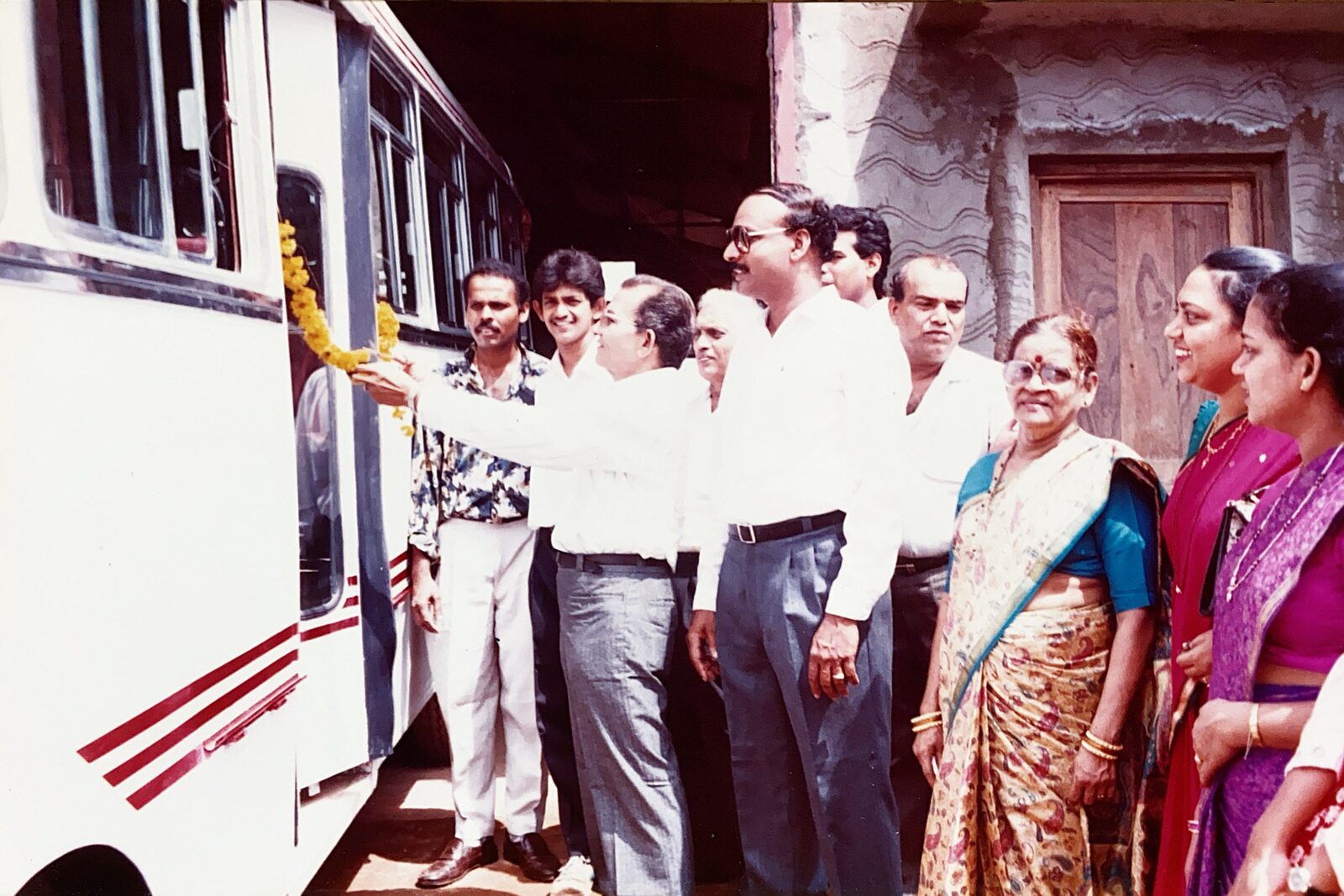 Inauguration of an Ultratech-built bus, garlanded ahead of handover